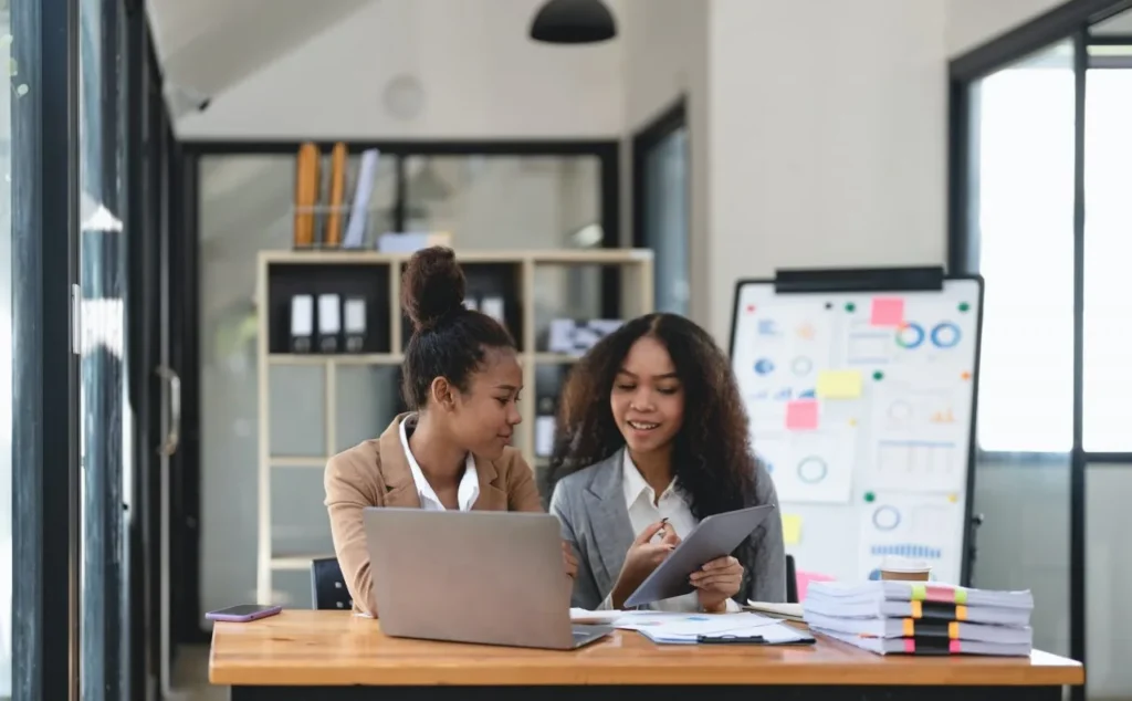 Two Young Business People Working Together In Office Financial Analysis Accounting Concept | PABLO NUÑEZ MOLINA